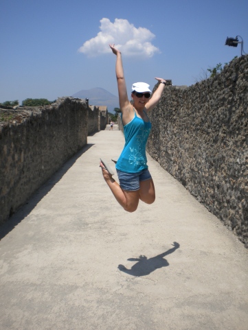 Jumping in the ancient streets of Pompeji, Mount Vesuvius, Italy